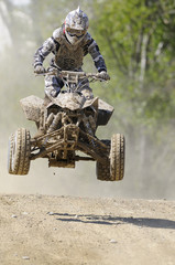 quad jump dusty road