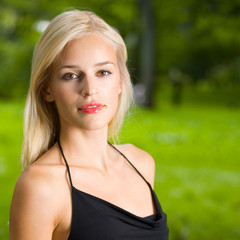Naklejka premium Young beautiful woman, outdoors