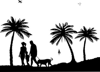 Family walking on beach with dog between the palms silhouette