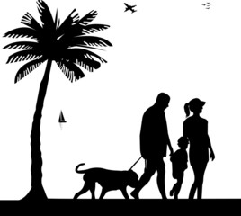 Family walking on beach with dog between the palms silhouette