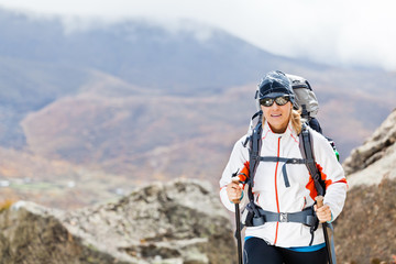 Woman trekking in mountains, Nepal