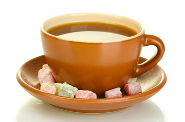 A cup of tea with a delicious turkish delight isolated on white