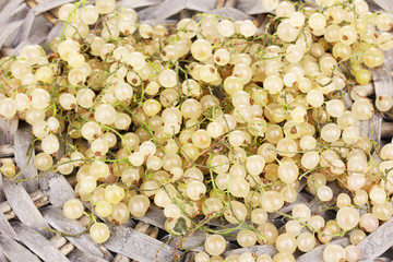 White currants on wicker mat close-up