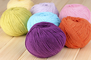 Knitting yarn on wooden background