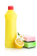 Dishwashing liquid with sponges and lemon with flowers isolated