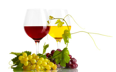 glasses of wine and ripe grapes with leaves isolated on white