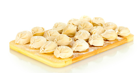 Raw Dumplings on cutting board isolated on white