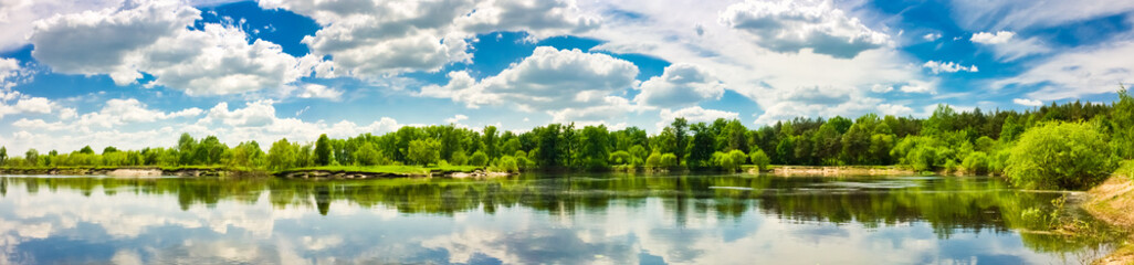 Fototapeta na wymiar Clouds reflection on lake.