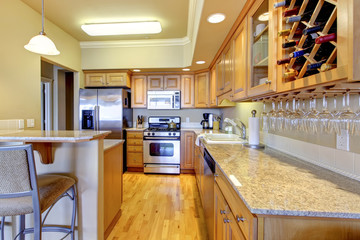 Wood golden kitchen in luxury apartment.