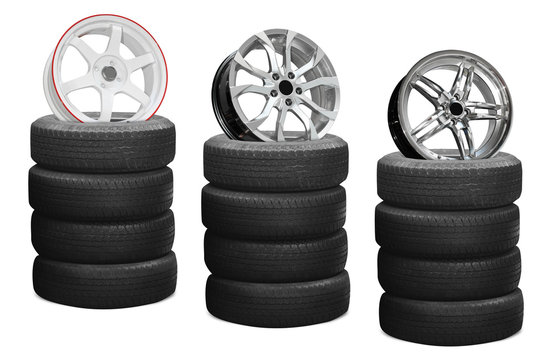 Car alloy wheels on tires, isolated on white background 