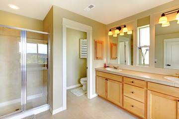 Beautiful classic bathroom with double sink and shower.