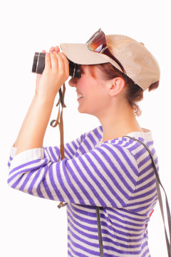 Beautiful young girl looking through binoculars