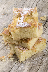 freshly baked apple cake with almond flakes