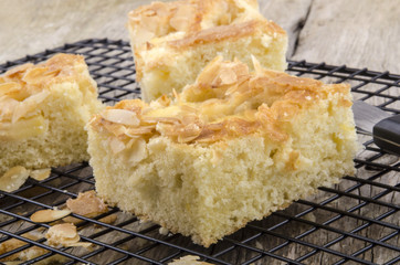 freshly baked apple cake with almond flakes