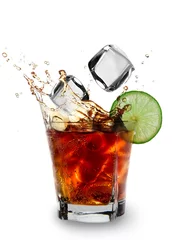 Tuinposter Ice cube and lime splashing cola glass, Cuba Libre drink © Lukas Gojda