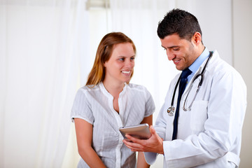 Professional medical doctor with a patient
