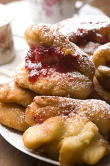 Sweet doughnuts with rose marmelade