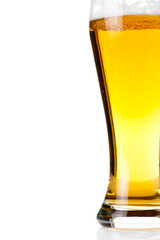 Beer into glass isolated on white