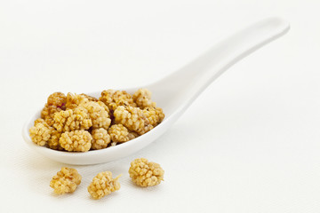 spoon of dried white mulberries