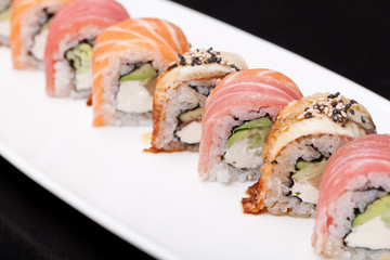 assorted sushi on white plate