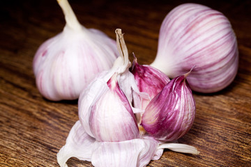 Garlic on wooden brown background