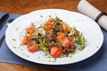 Tofu marinated in soy sauce with tomato and salad