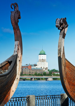 ancient castle in the background of Drakkar Viking in Vyborg