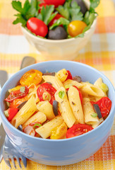 Penne pasta with cherry tomatoes and basil