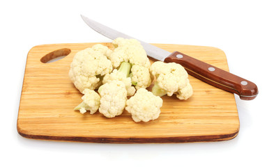 Fresh cauliflower and knife on cutting board isolated on white