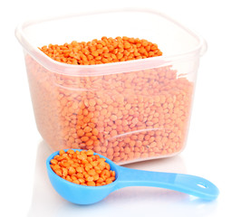 Measuring spoons and plastic containers with grain isolated