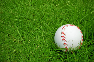 baseball on green grass pitch