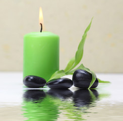 candle light, leaf and stones