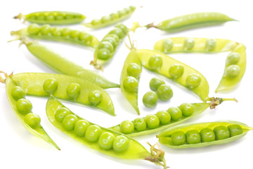 green pea pods on white background
