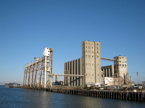 Large old rundown cement factory along the water