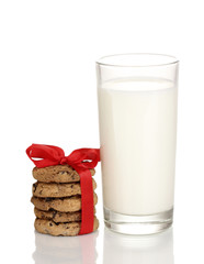 Glass of milk and cookies isolated on white