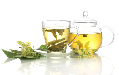 cup and teapot of linden tea and flowers isolated on white
