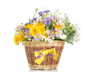 beautiful bouquet of bright  wildflowers in basket, isolated