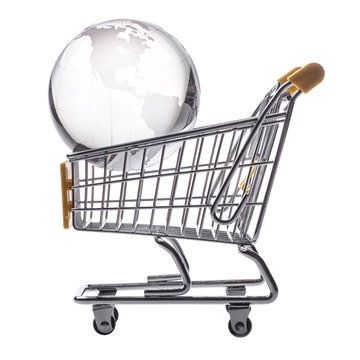 isolated shopping cart and globe on the white