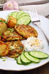 Zucchini Fritters and slices of new potatoes.