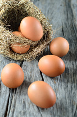 Colorful eggs on old wooden background