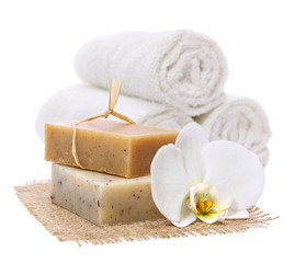 Natural, organic soap bars on burlap with white orchid