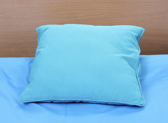 bright pillow on bed
