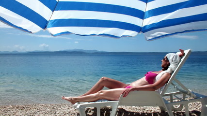 Woman under umbrella - Powered by Adobe