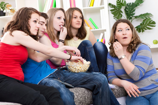 Teenagers  watching TV