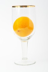 Fresh orange in glass cup