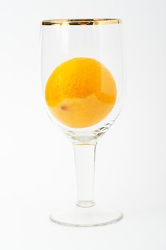 Fresh orange in glass cup