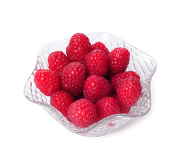 Raspberries in a crystal bowl isolated on white background