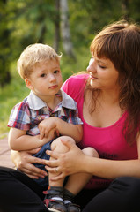 The little boy with mum on walk