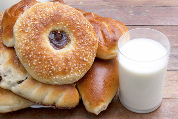 Appetizing baked house pies with fresh milk