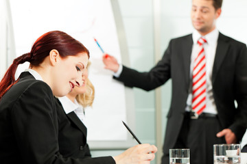Business people - presentation within a team
